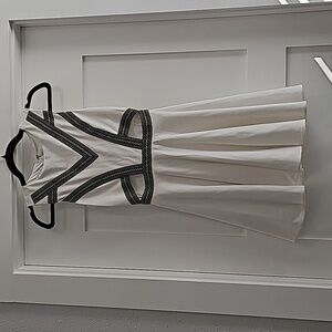 Bebe sleeveless mini dress. With exposed ribs, 38"  skirt twirl. homecoming